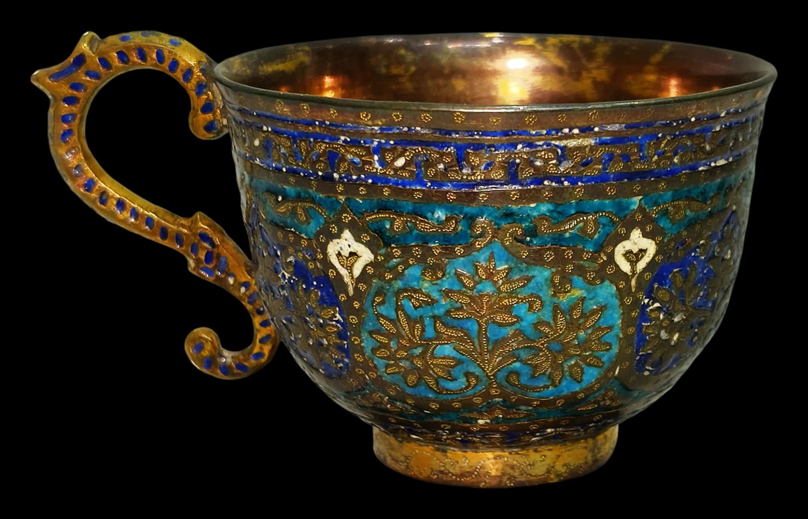 Blue and gold enamelled brass cup with ornate handle