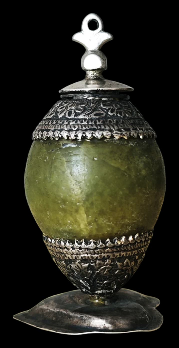 Green serpentine stone vase with a silver filigree lid